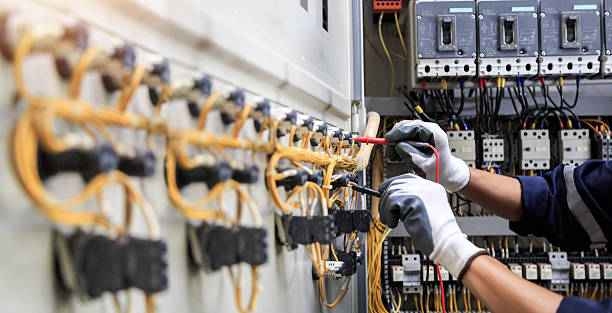 Professional Electrician technician working in Royal Palm Estates, FL